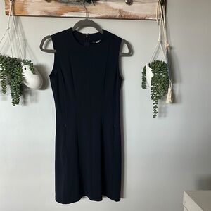 Black sleeveless golf dress knee-length